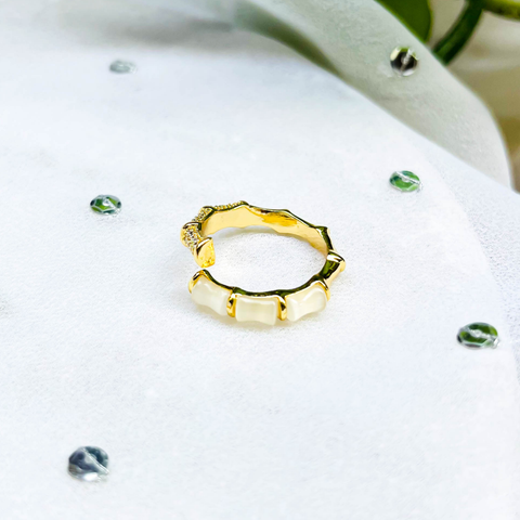 Minimal Snake Charm Ring – White Enamel Segments & Gold Bamboo-Inspired Base